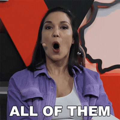 A Woman In A Purple Shirt With Her Mouth Open And The Words All Of Them Behind Her GIF