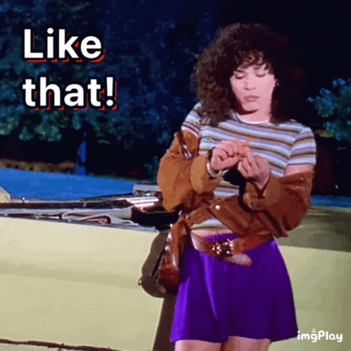 A Woman In A Purple Skirt Is Standing In Front Of A Car With The Words " Like That " Above Her GIF