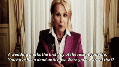 A Woman In A Purple Suit Says " A Wedding Marks The First Day Of The Rest Of Your Life GIF
