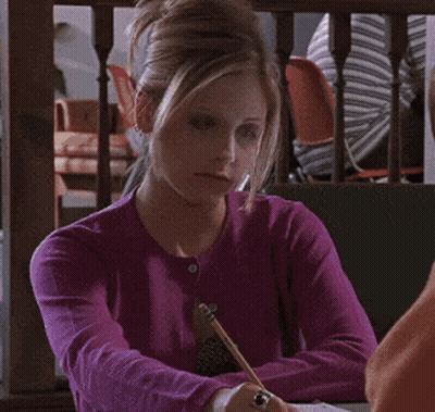 A Woman In A Purple Sweater Is Sitting At A Table And Says " You 'Re Not Stupid " GIF