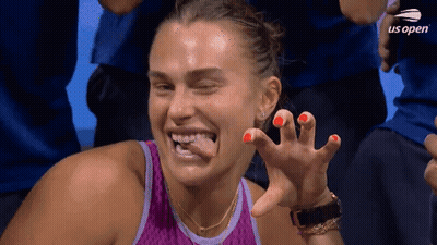 A Woman In A Purple Tank Top Is Making A Funny Face At The Us Open Tennis Tournament GIF