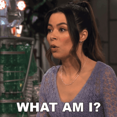 A Woman In A Purple Top Is Asking The Question What Am I GIF