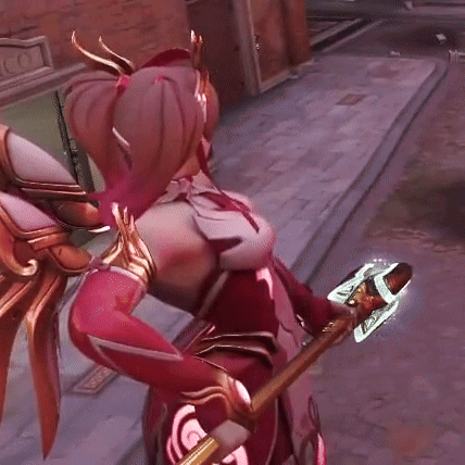 A Woman In A Red And Gold Costume Is Holding A Sword GIF