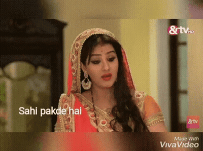 A Woman In A Red And Gold Dress With The Words Sahi Pakde Hai GIF