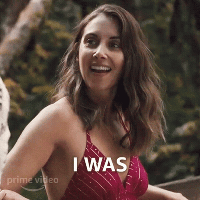A Woman In A Red Bikini Top Is Smiling And Saying I Was . GIF