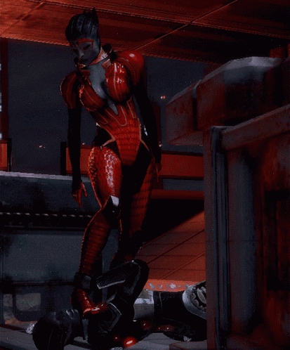 A Woman In A Red Bodysuit Is Standing Next To A Man In A Black Suit GIF