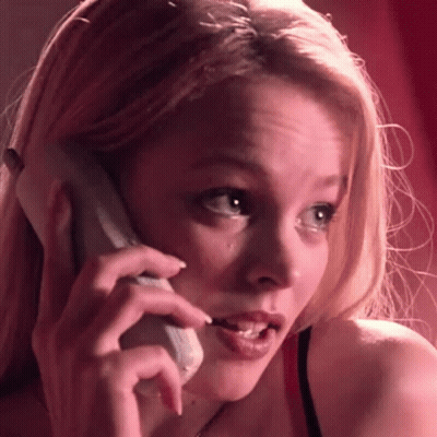 A Woman In A Red Bra Is Talking On A Cell Phone . GIF