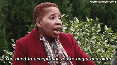 A Woman In A Red Coat And Scarf Is Saying `` You Need To Accept That You 'Re Angry And Bitter '' GIF