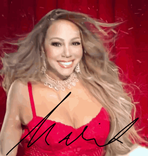 A Woman In A Red Dress Has A Signature On Her Chest That Says Mariah GIF