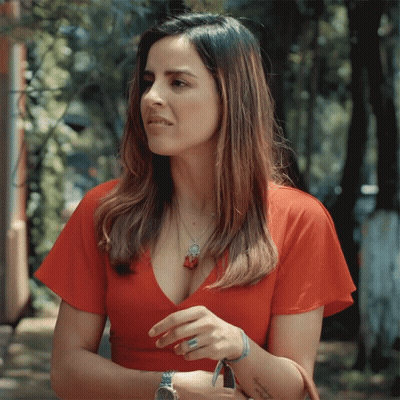A Woman In A Red Dress Has A Tattoo On Her Wrist That Says " I Love You " GIF