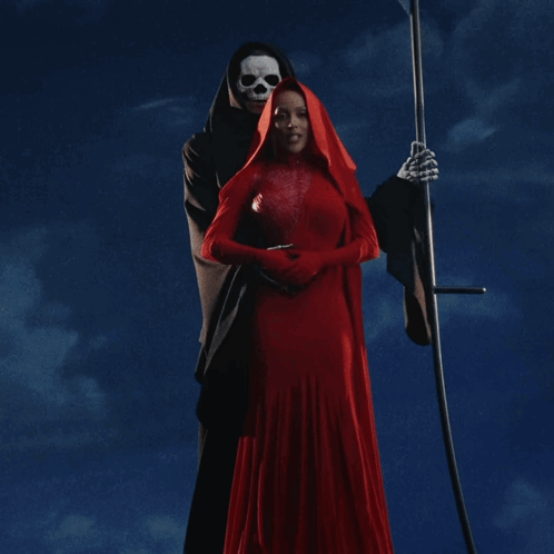 A Woman In A Red Dress Is Being Held By A Grim Reaper GIF