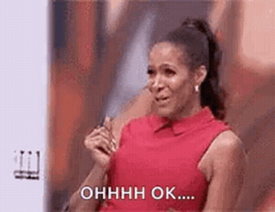 A Woman In A Red Dress Is Crying On A Stage And Saying `` Ohhhh Ok ... '' . GIF