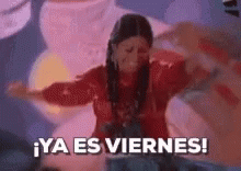 A Woman In A Red Dress Is Dancing With Her Arms Outstretched And The Words `` Ya Es Viernes '' Written Below Her . GIF