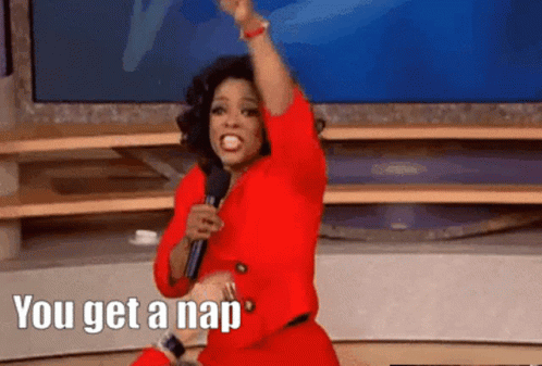 A Woman In A Red Dress Is Holding A Microphone And Says You Get A Nap GIF