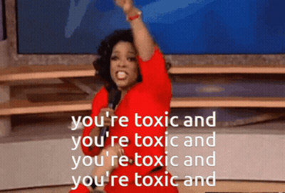 A Woman In A Red Dress Is Holding A Microphone And Says You 'Re Toxic And You 'Re Toxic GIF