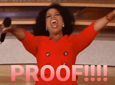 A Woman In A Red Dress Is Holding A Microphone And The Word Proof Is Behind Her GIF