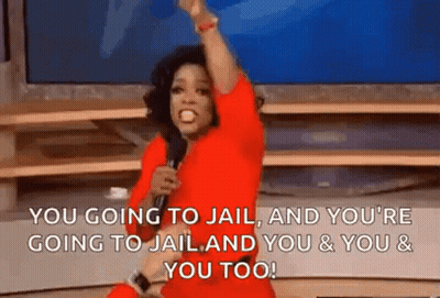 A Woman In A Red Dress Is Holding A Microphone In Front Of A Television And Screaming . GIF