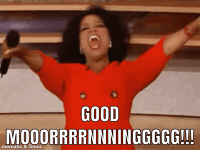 A Woman In A Red Dress Is Holding A Microphone With Her Arms In The Air And Says " Good " GIF