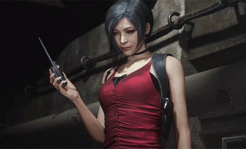 A Woman In A Red Dress Is Holding A Walkie Talkie In Her Hand GIF