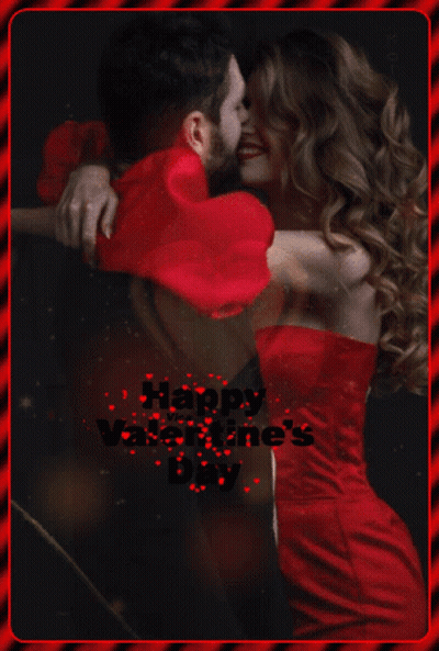 A Woman In A Red Dress Is Hugging A Man In A Red Heart Shaped Pillow GIF