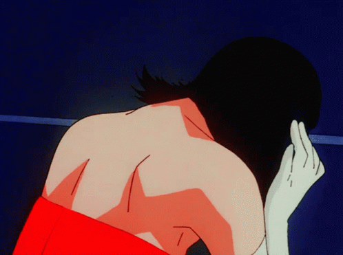 A Woman In A Red Dress Is Looking Down GIF