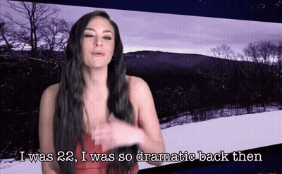 A Woman In A Red Dress Is Saying I Was 22 I Was So Dramatic Back Then GIF