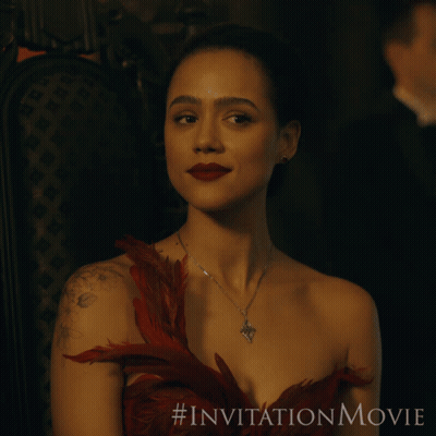 A Woman In A Red Dress Is Sitting In A Chair With The # Invitationmovie Written On The Bottom GIF