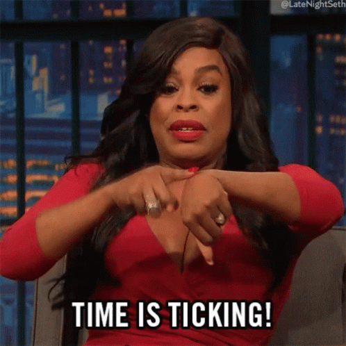 A Woman In A Red Dress Is Sitting On A Couch And Says Time Is Ticking . GIF