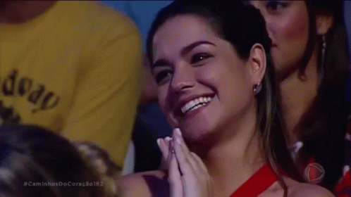 Woman In Red Dress Smiling And Clapping GIF