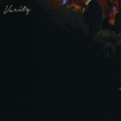 A Woman In A Red Dress Is Standing At A Bar With The Word Verity Written On The Bottom GIF