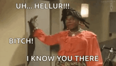 A Woman In A Red Dress Is Standing In Front Of A Door And Holding A Cat . GIF