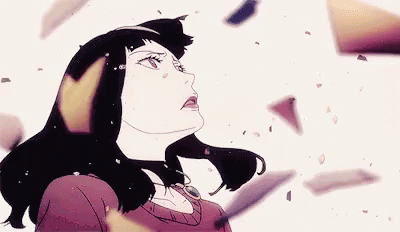 A Woman In A Red Dress Is Standing In Front Of A Pile Of Broken Pieces . GIF