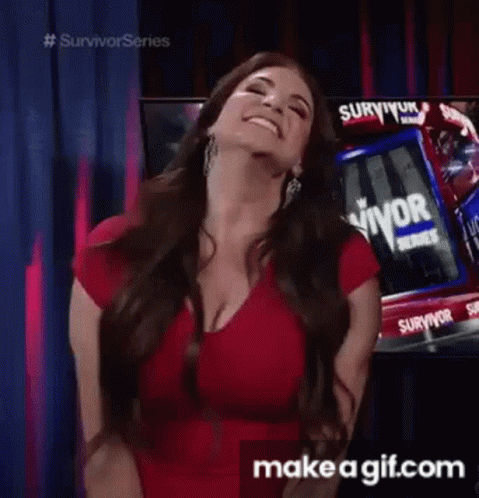 A Woman In A Red Dress Is Standing In Front Of A Survivor Truck And Smiling . GIF