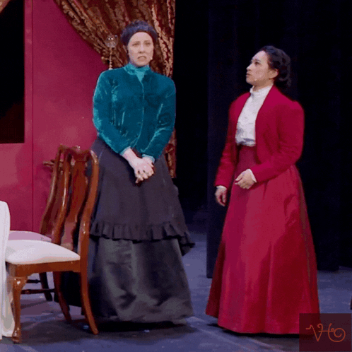 A Woman In A Red Dress Is Standing Next To Another Woman In A Blue Jacket And The Words Please No Are Above Them GIF