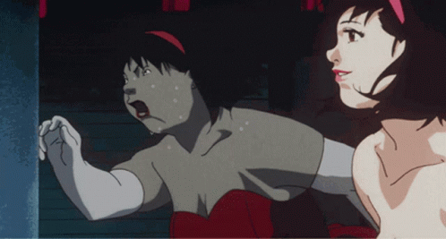 A Woman In A Red Dress Is Standing Next To Another Woman In A White Shirt GIF