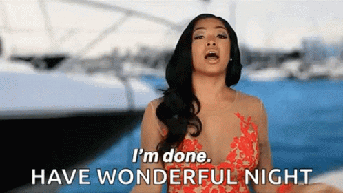 A Woman In A Red Dress Is Standing On A Boat And Says `` I 'M Done . Have Wonderful Night '' . GIF