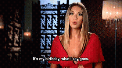 A Woman In A Red Dress Is Talking About Her Birthday GIF