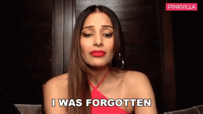 A Woman In A Red Dress Is Talking And Says I Was Forgotten . GIF