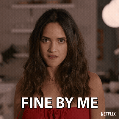 A Woman In A Red Dress Says " Fine By Me " GIF