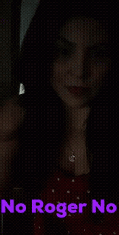 A Woman In A Red Dress Says " No Roger No " In Purple Text GIF