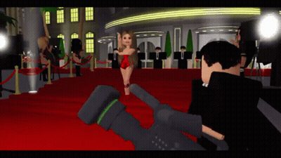 A Woman In A Red Dress Stands On A Red Carpet In Front Of A Camera GIF