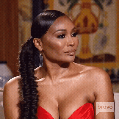 A Woman In A Red Dress With Bravo Written On The Bottom GIF