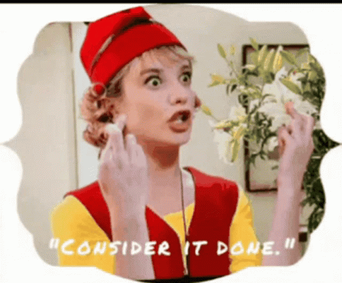 A Woman In A Red Hat Is Holding A White Flower And Says " Consider It Done " GIF