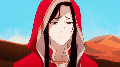 A Woman In A Red Hooded Jacket Is Standing In Front Of A Desert GIF