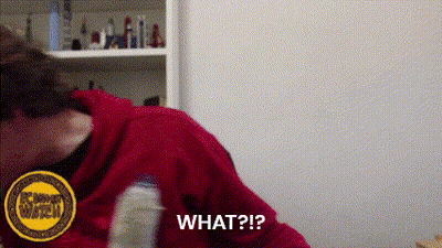 A Woman In A Red Hoodie Is Holding A Bottle And Asking What ? GIF