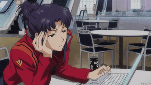 A Woman In A Red Jacket Is Sitting At A Table With A Laptop And A Can Of Black Coffee GIF