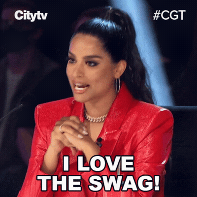 A Woman In A Red Jacket Is Sitting In Front Of A Microphone And Says " I Love The Swag " GIF