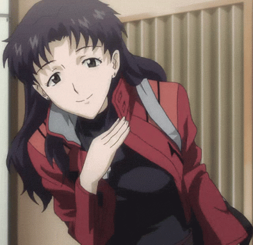 A Woman In A Red Jacket Is Smiling And Holding Her Hand To Her Chest GIF