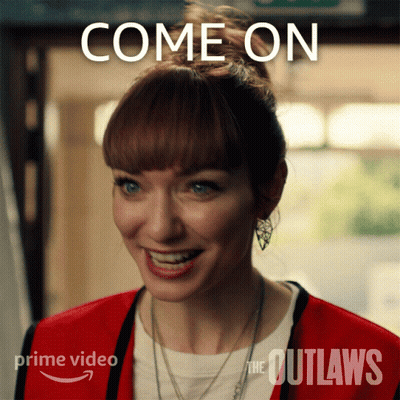 A Woman In A Red Jacket Is Smiling With The Words Come On Behind Her GIF