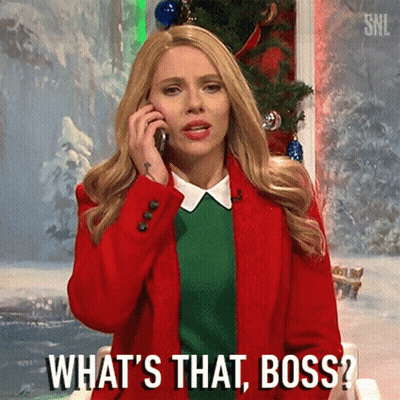 A Woman In A Red Jacket Is Talking On A Cell Phone And Asking What 'S That Boss . GIF